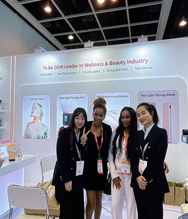 Wakelife sales representatives take photos with customers at a beauty show