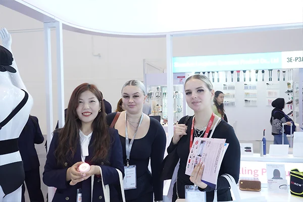 Wakelife sales representatives take photos with customers at a beauty show