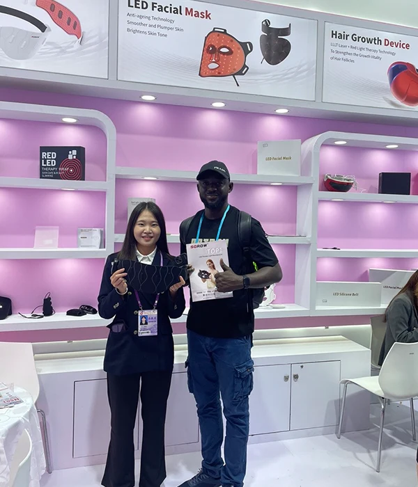 Wakelife sales representatives take photos with customers at a beauty show