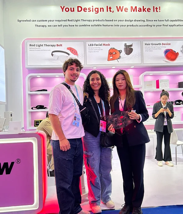 Wakelife sales representatives take photos with customers at a beauty show