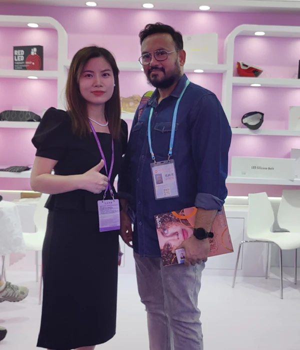 Wakelife sales representatives take photos with customers at a beauty show