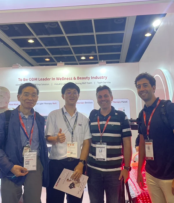 Wakelife sales representatives take photos with customers at a beauty show