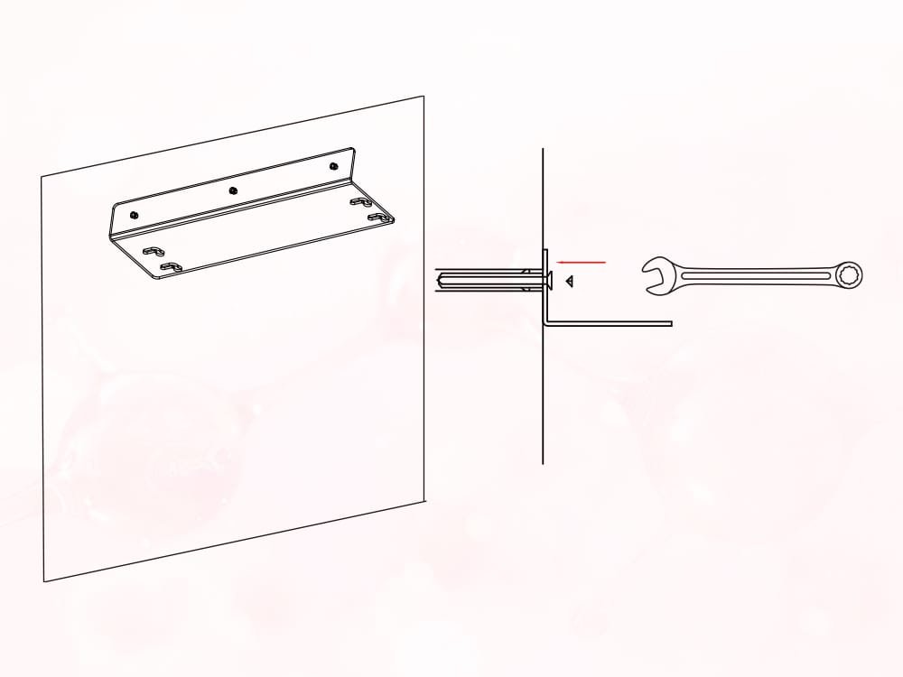 Securing the mounting bracket to the wall with a wrench.