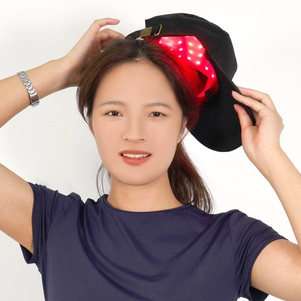 Woman wearing C02 cap with red LEDs