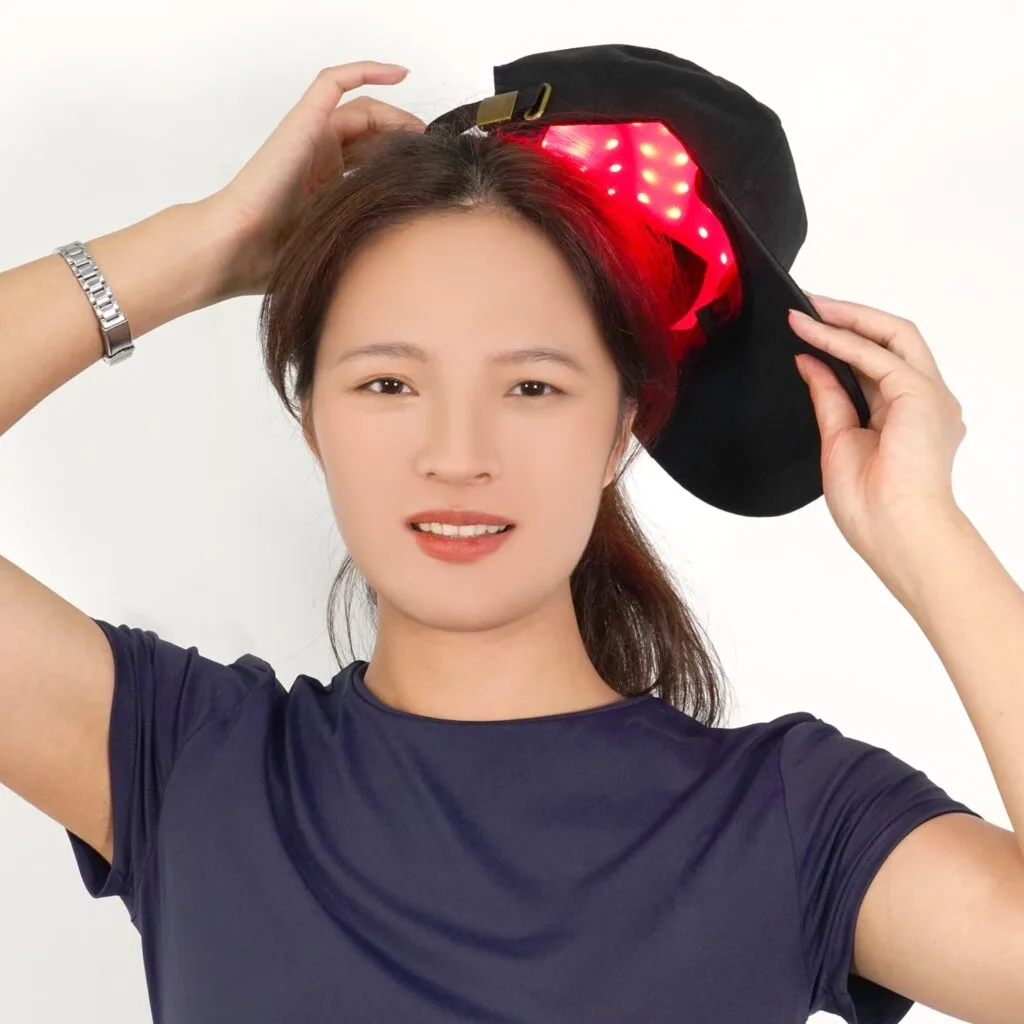 Woman wearing C02 cap with red LEDs
