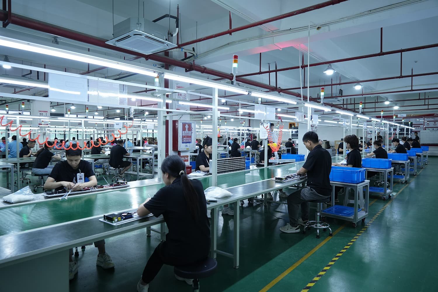 LED red light therapy device manufacturing line with multiple assembly stations