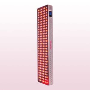 Wakelife BK900 UVB tanning panel illuminated with red and purple multi-wavelength LED light output