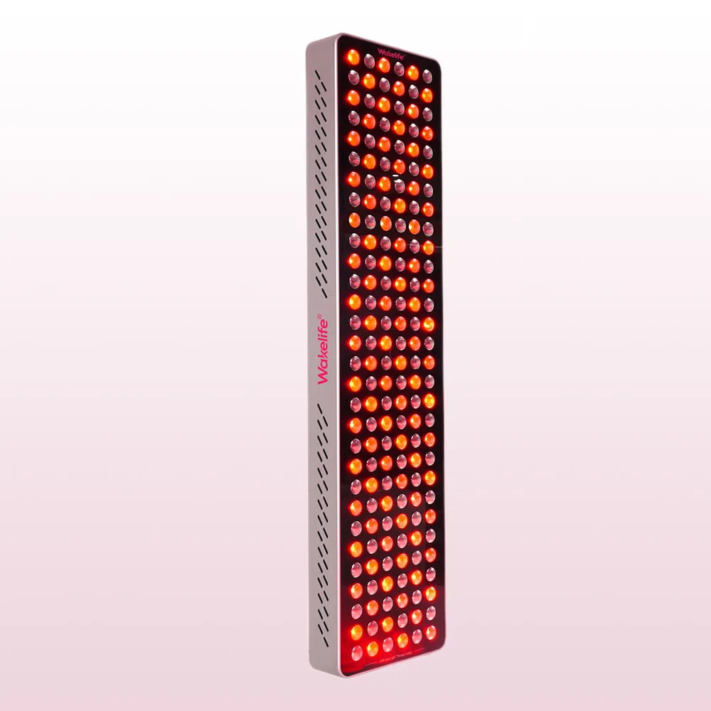 Wakelife BK900 UVB tanning panel side angled view with illuminated red LED light output